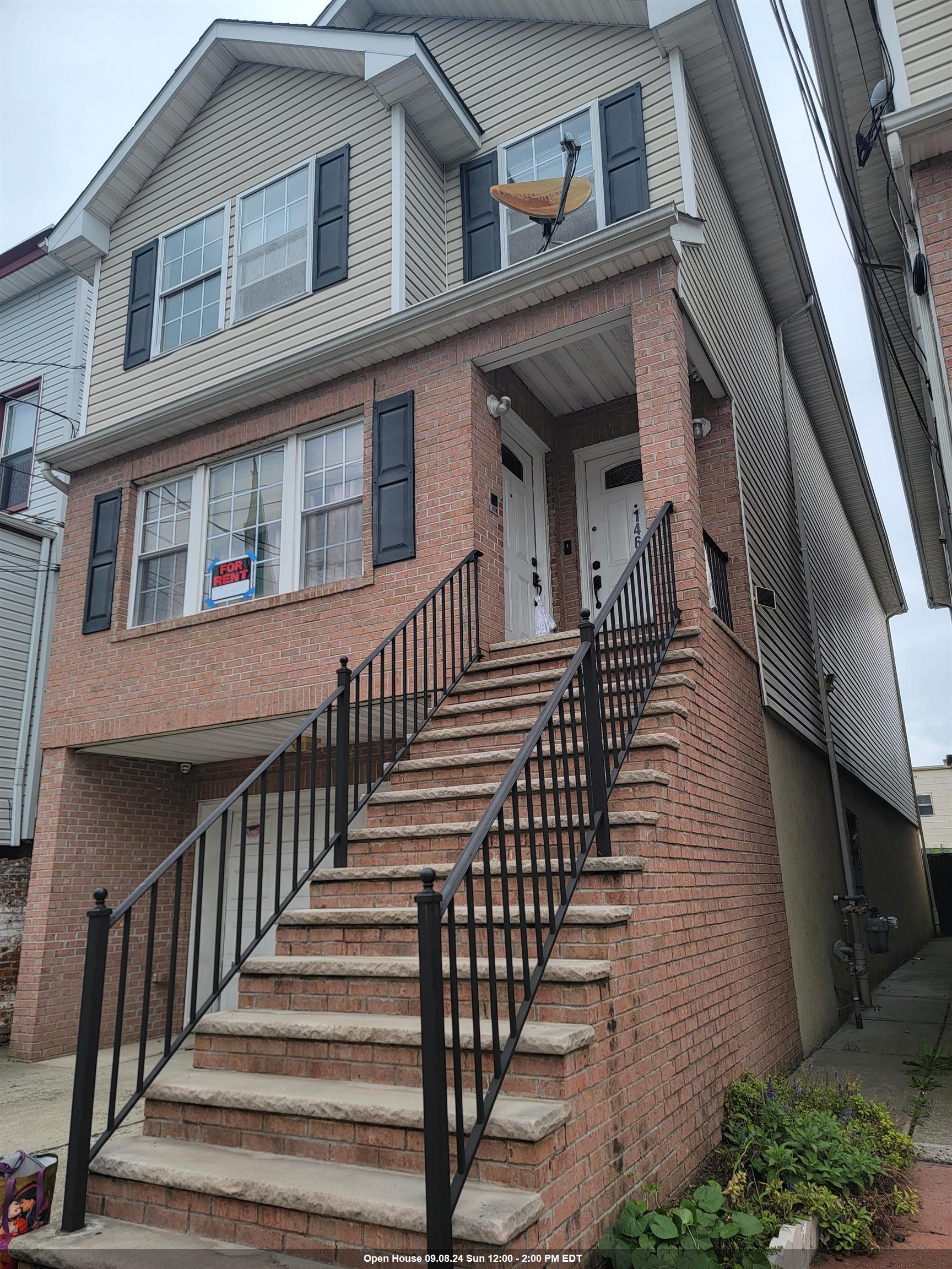 a view of a brick house with many windows