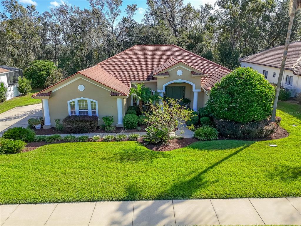 a aerial view of a house with a yard