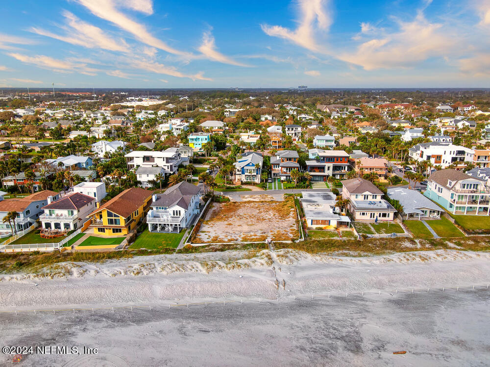 an aerial view of residential building with swimming pool