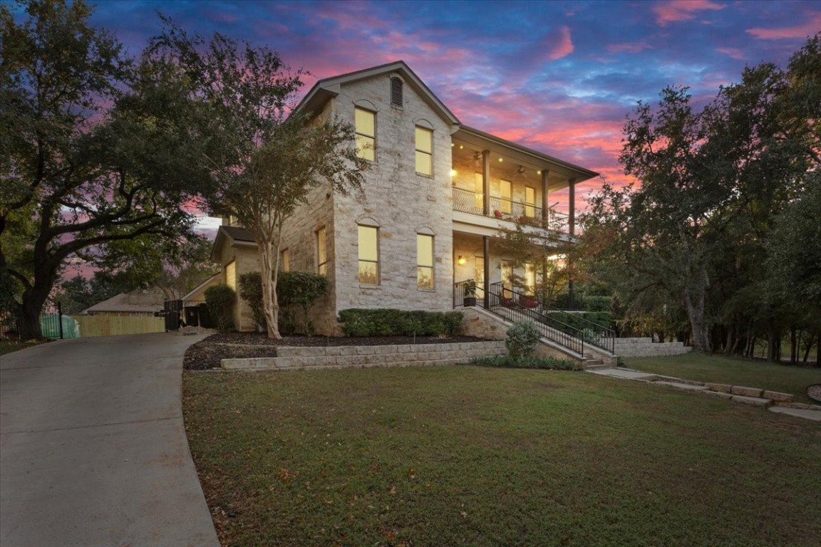 Welcome to 806 Hillcrest Drive, perched atop a scenic hill in Salado's Mill Creek community. This custom-built home exudes Southern charm with its inviting facade, mature trees, and commanding presence.