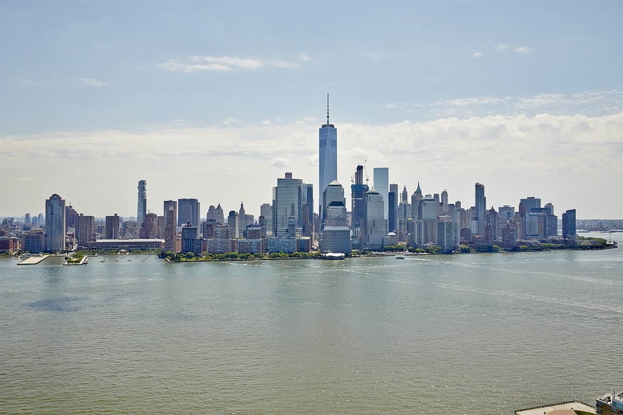 a view of a city with water in front of it