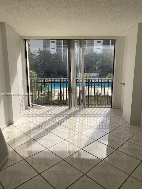 a view of an empty room with a balcony