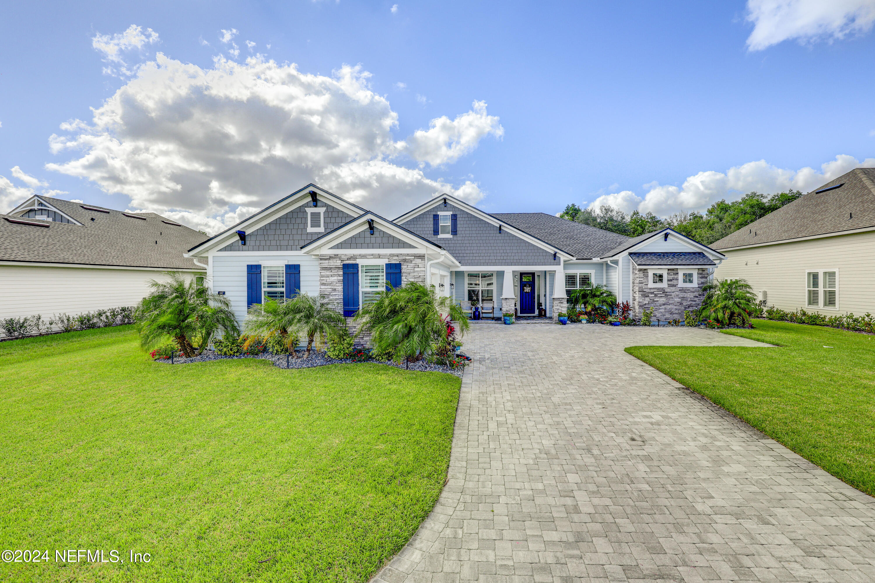 a front view of a house with garden