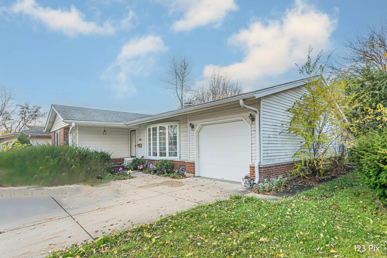 a front view of a house with garden