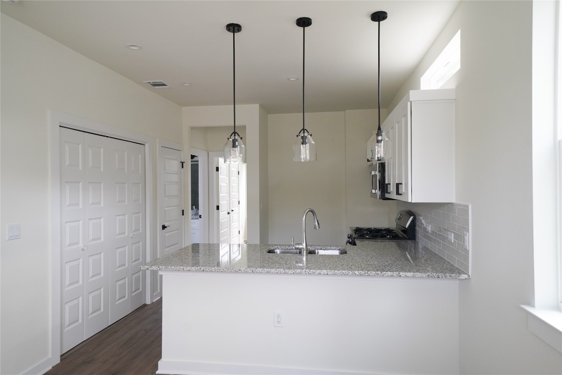 a bathroom with double vanity and a shower