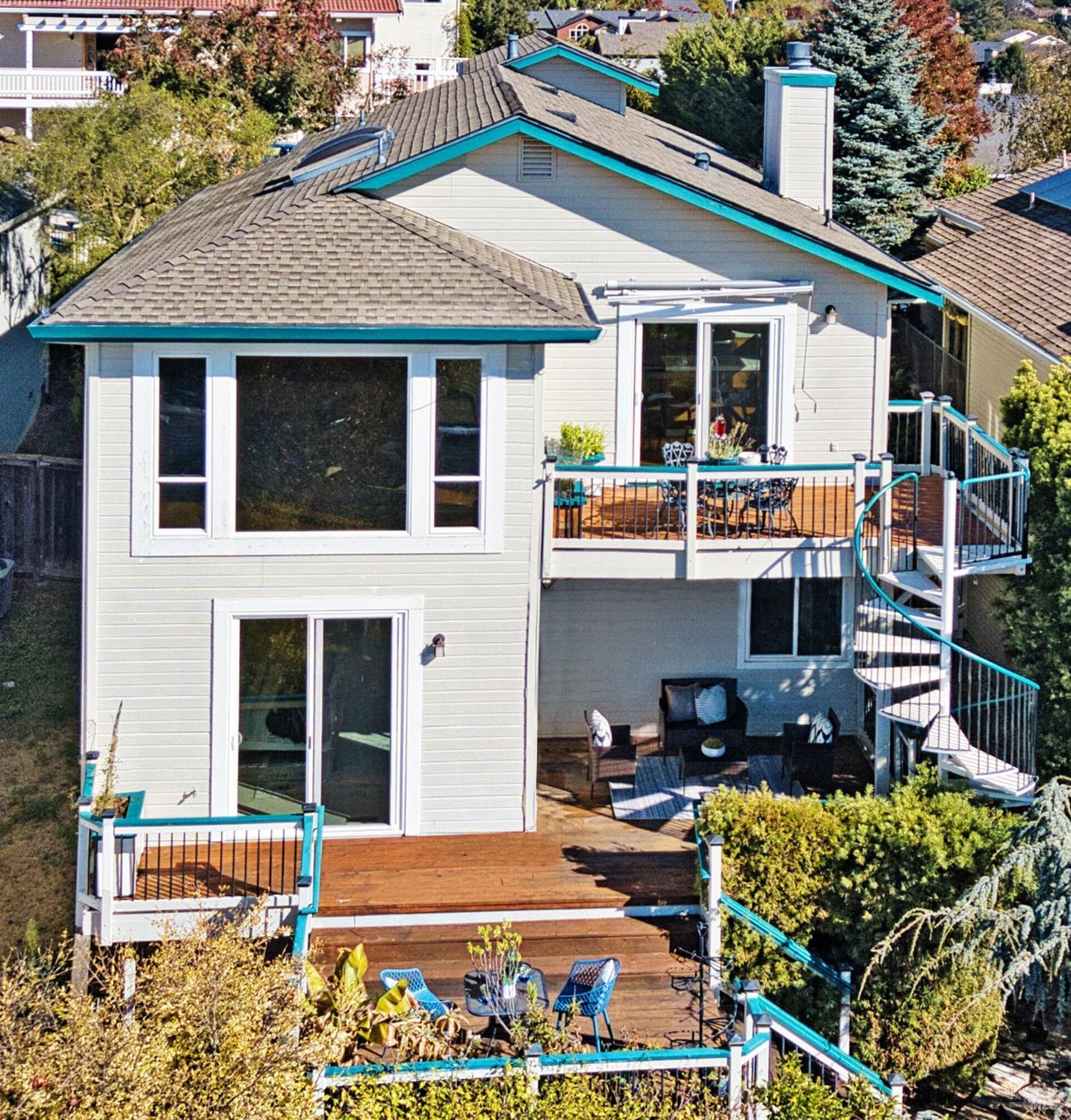 a front view of a house with lots of green space