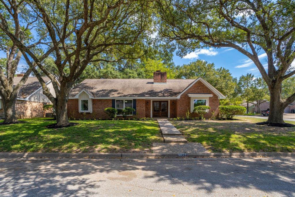 Welcome to this charming one-story home, perfectly situated on a generously sized corner lot surrounded by mature trees that enhance its natural beauty.