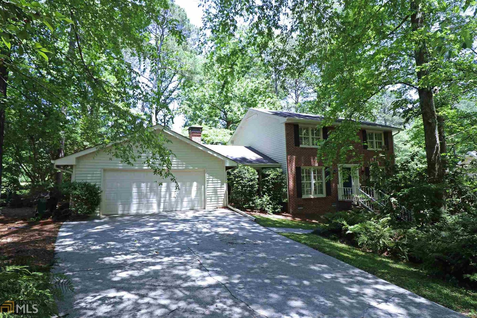 a front view of house with green space