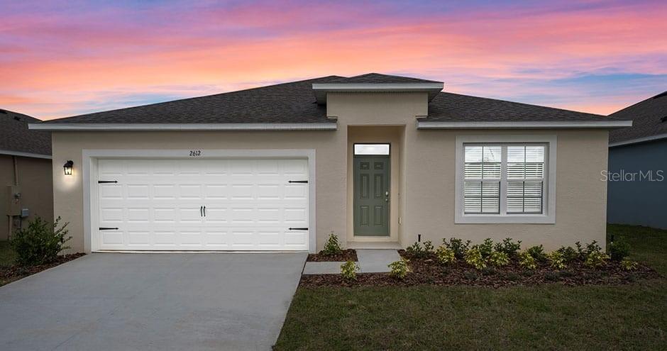 front view of house with a yard