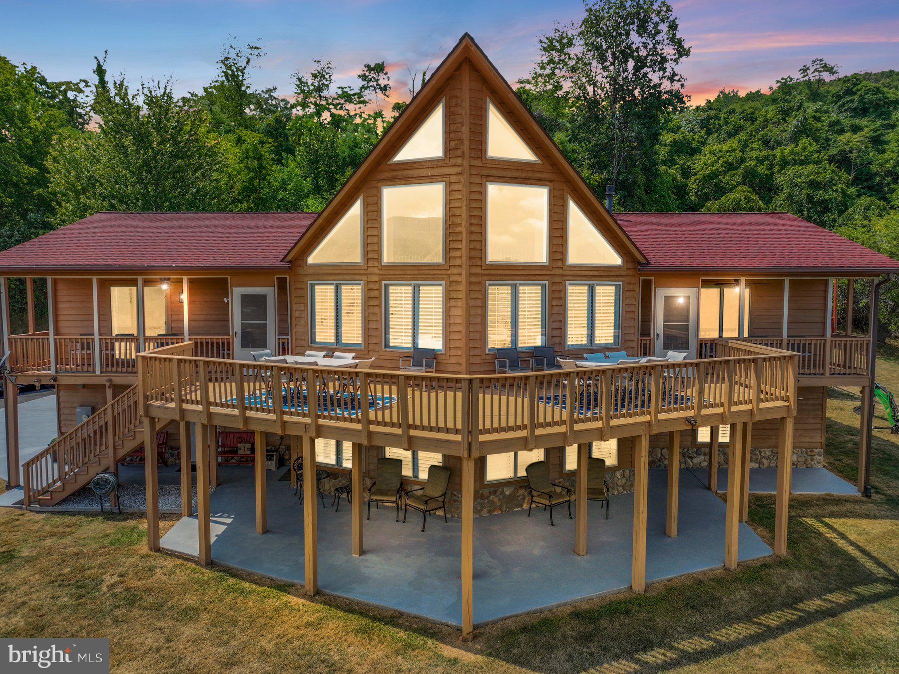 a view of a house with backyard porch and sitting area