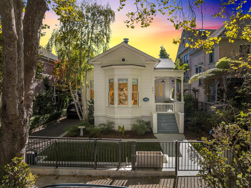 a front view of a house with trees