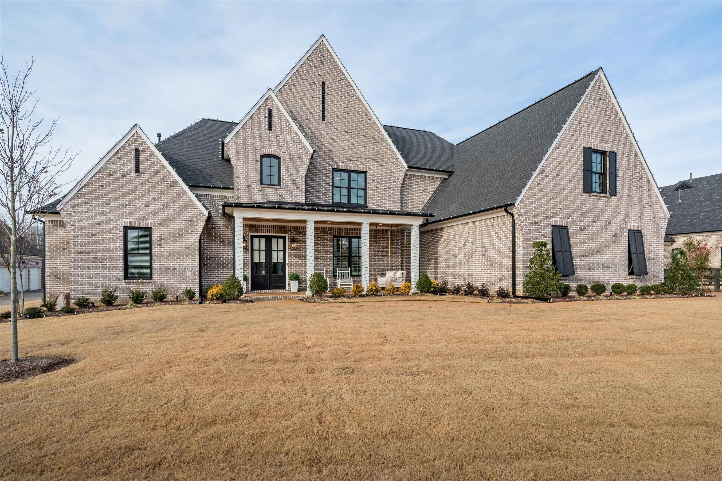 a front view of a house with a yard