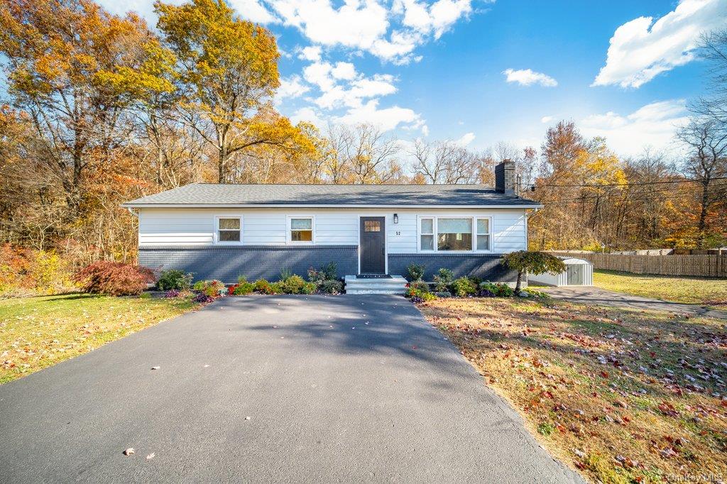 Ranch-style house with a front lawn