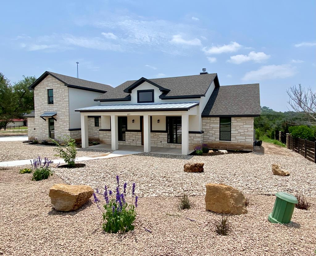 a front view of a house with a patio