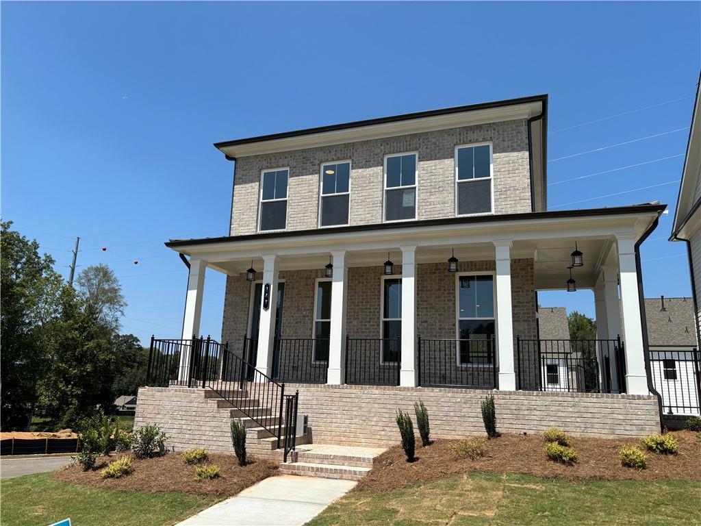 a front view of a house with a yard