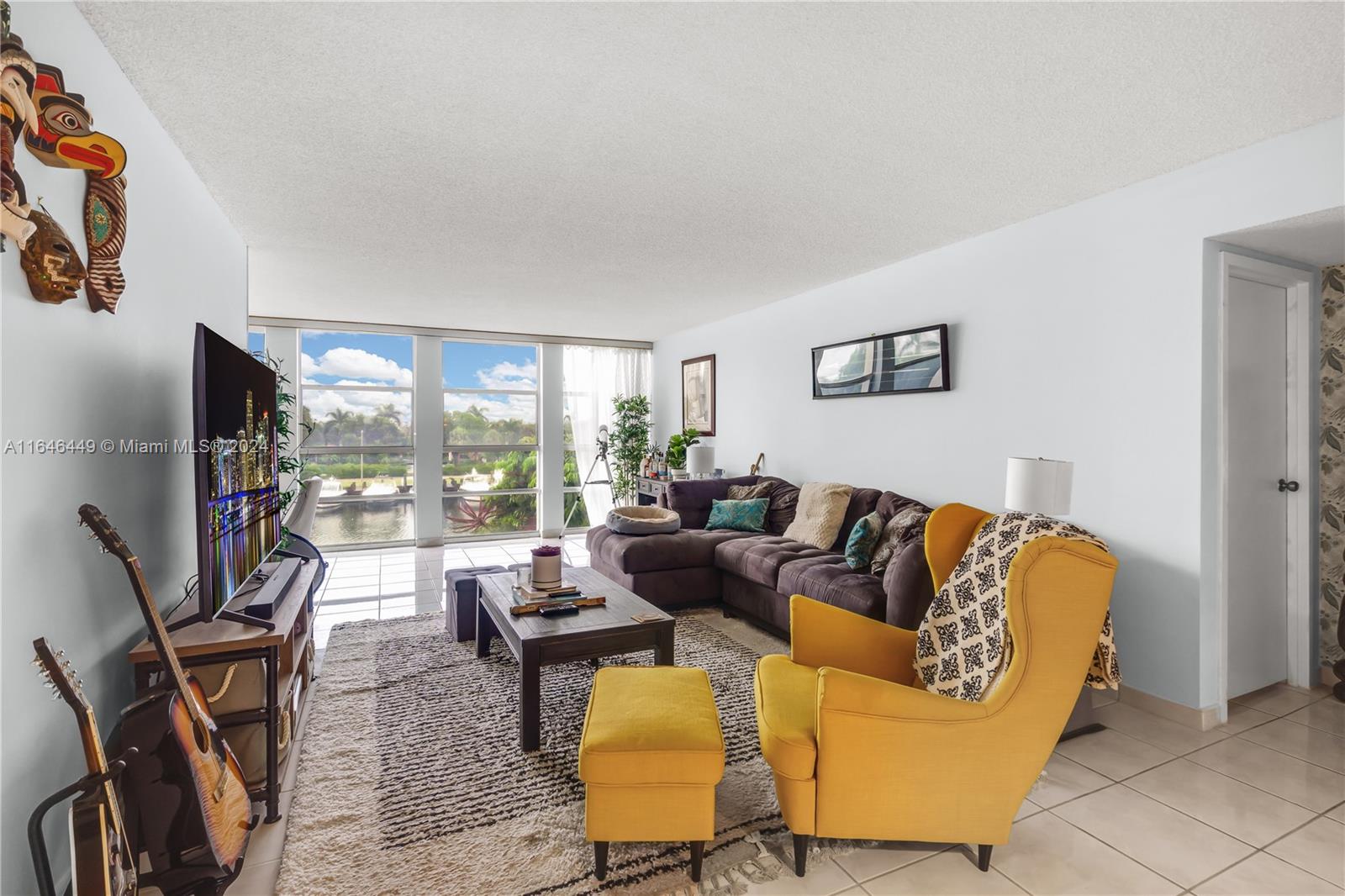 a living room with furniture fireplace and a flat screen tv