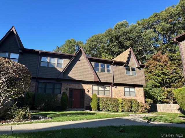 View of front of home featuring a front lawn