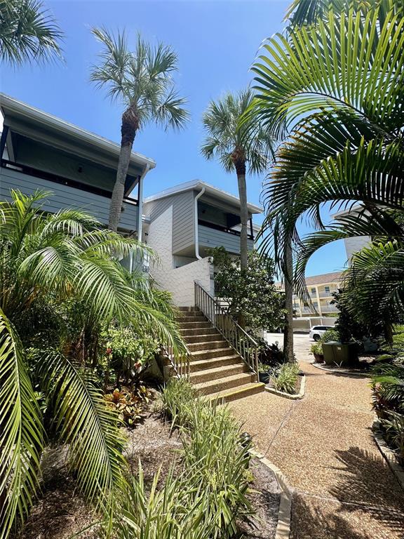 a view of a backyard of a house with a garden