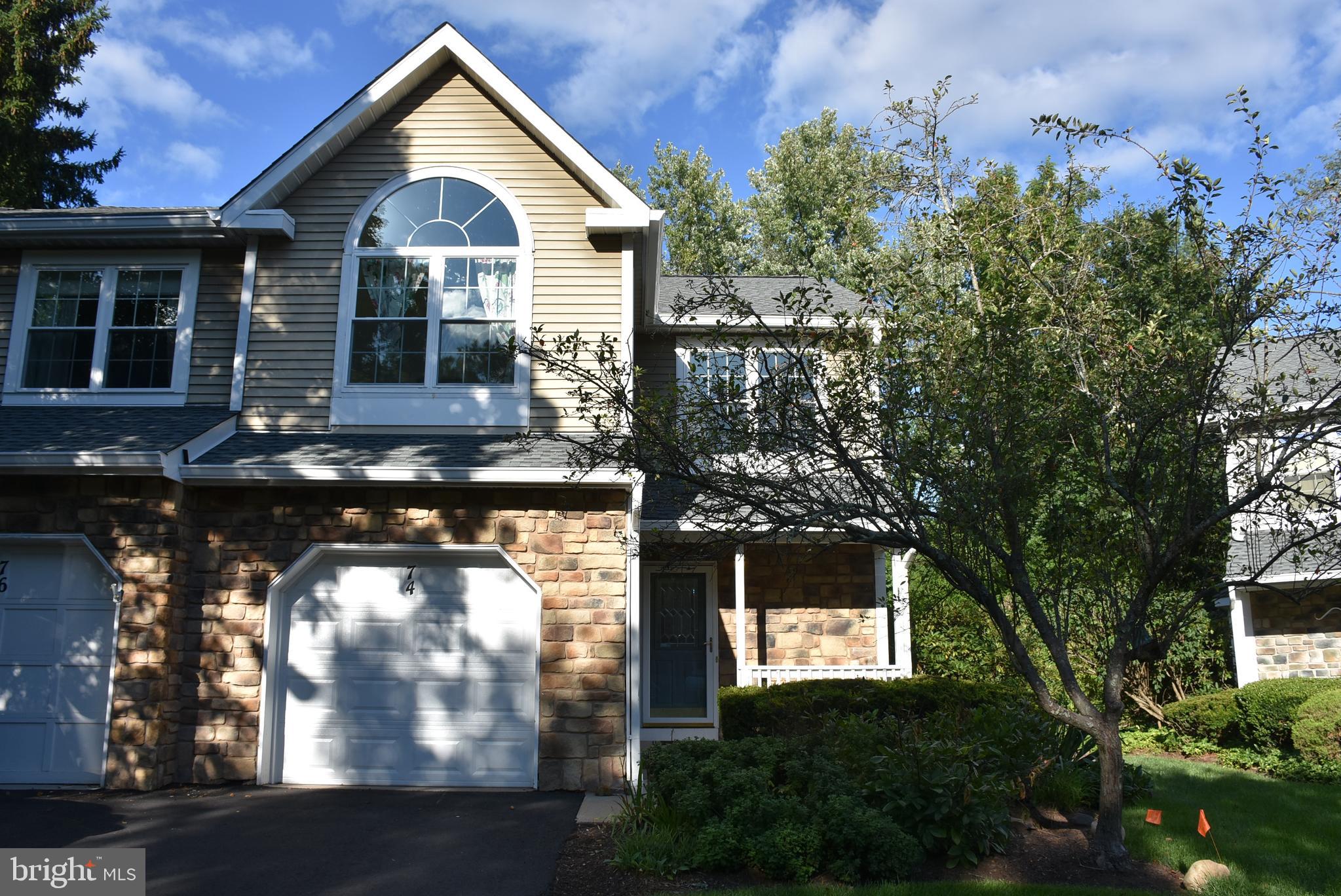 a front view of a house with yard