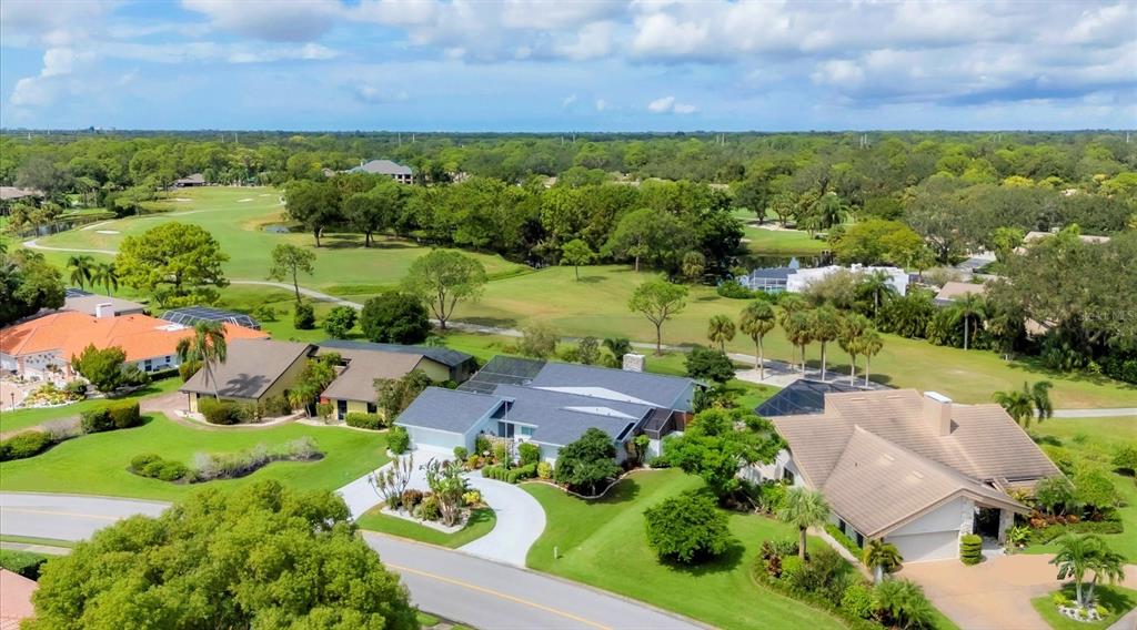 an aerial view of a houses with outdoor space and street view