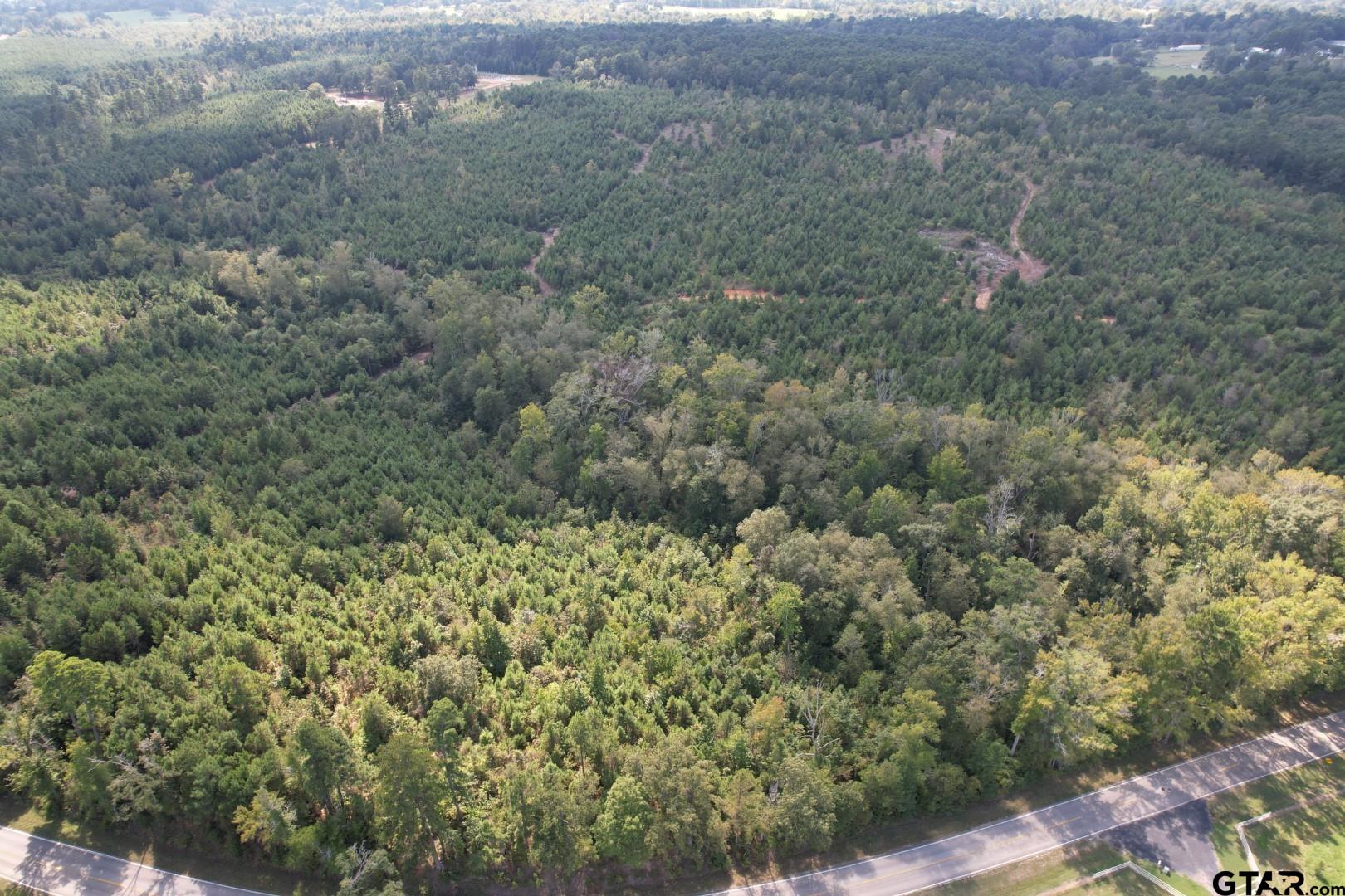 an aerial view of house with yard and mountain view