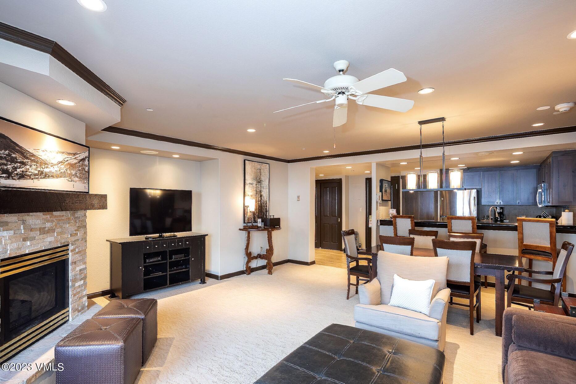 a living room with fireplace furniture and a flat screen tv