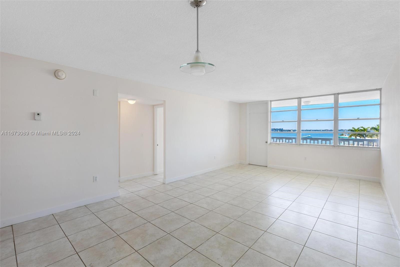 a view of an empty room with a window