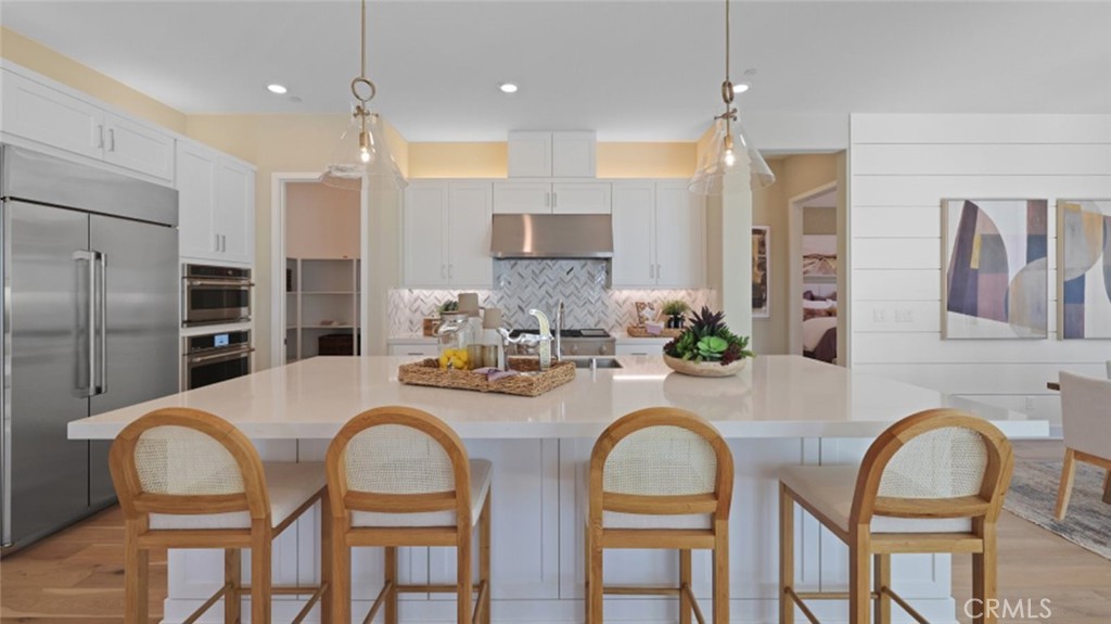 a kitchen with granite countertop cabinets and stainless steel appliances