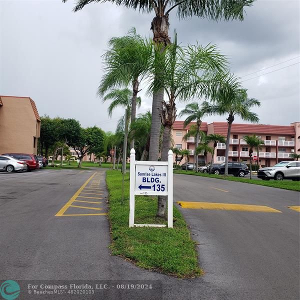 a sign board with parking space