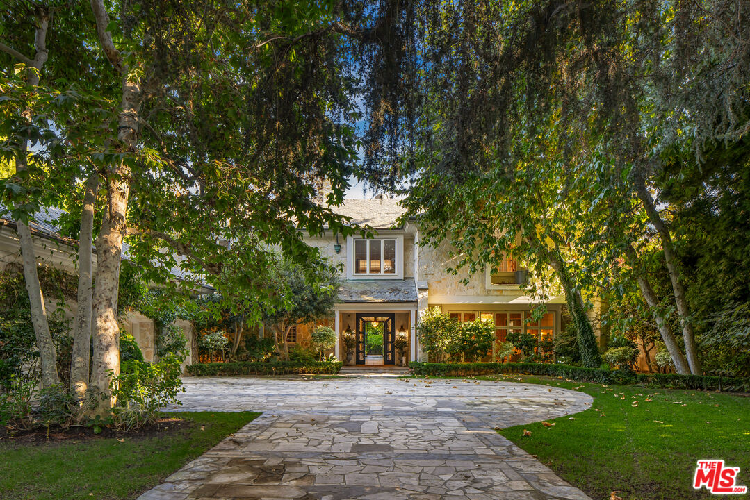 a front view of a building with garden