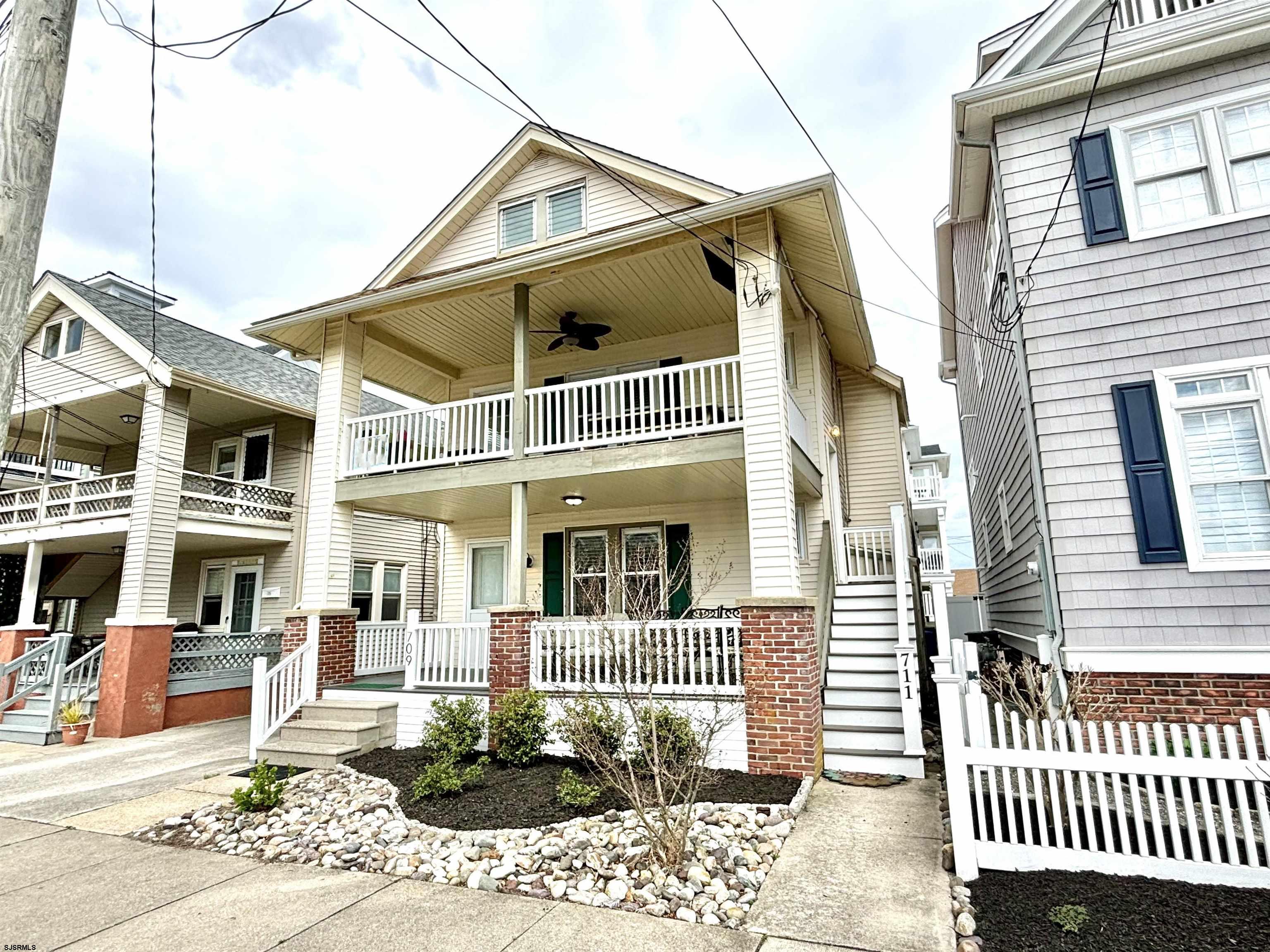 a front view of a house with a porch