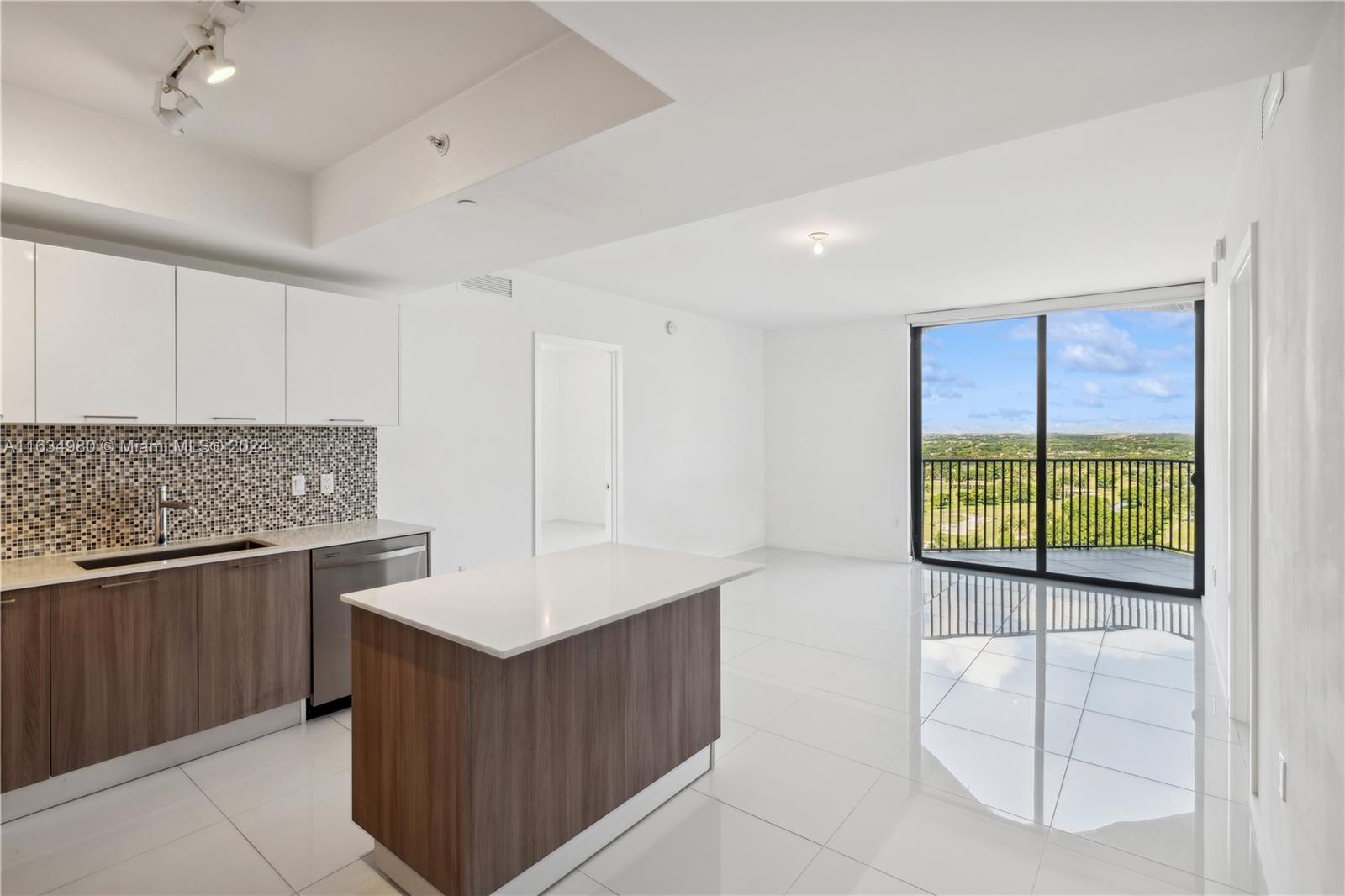 a kitchen with a sink and cabinet