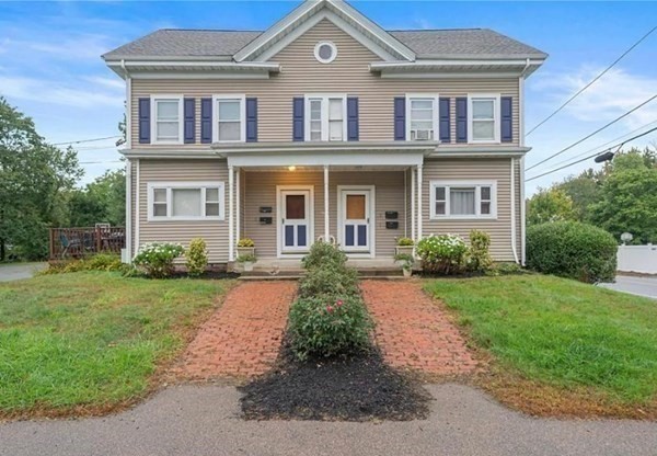 a front view of a house with a yard