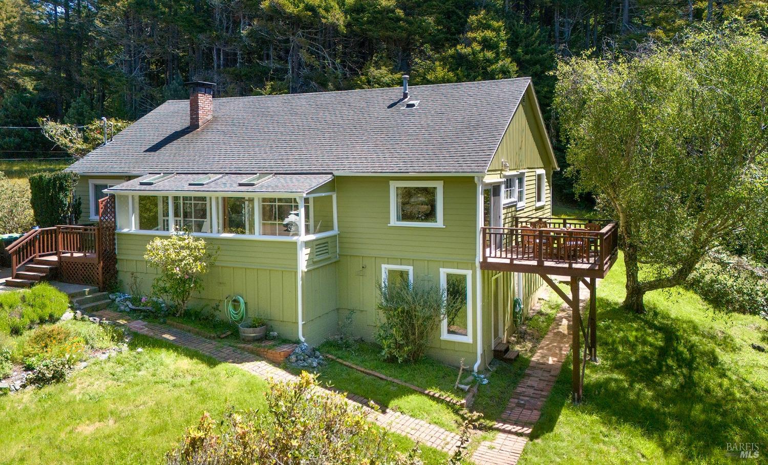 a aerial view of a house with a yard