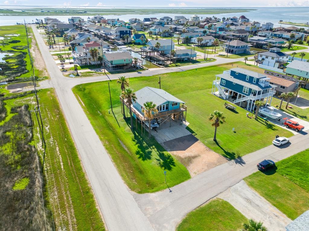 an aerial view of a house with a swimming pool