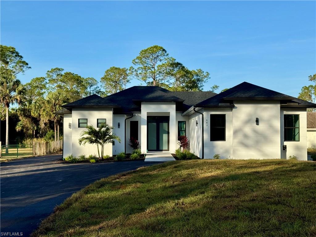 a front view of a house with a yard