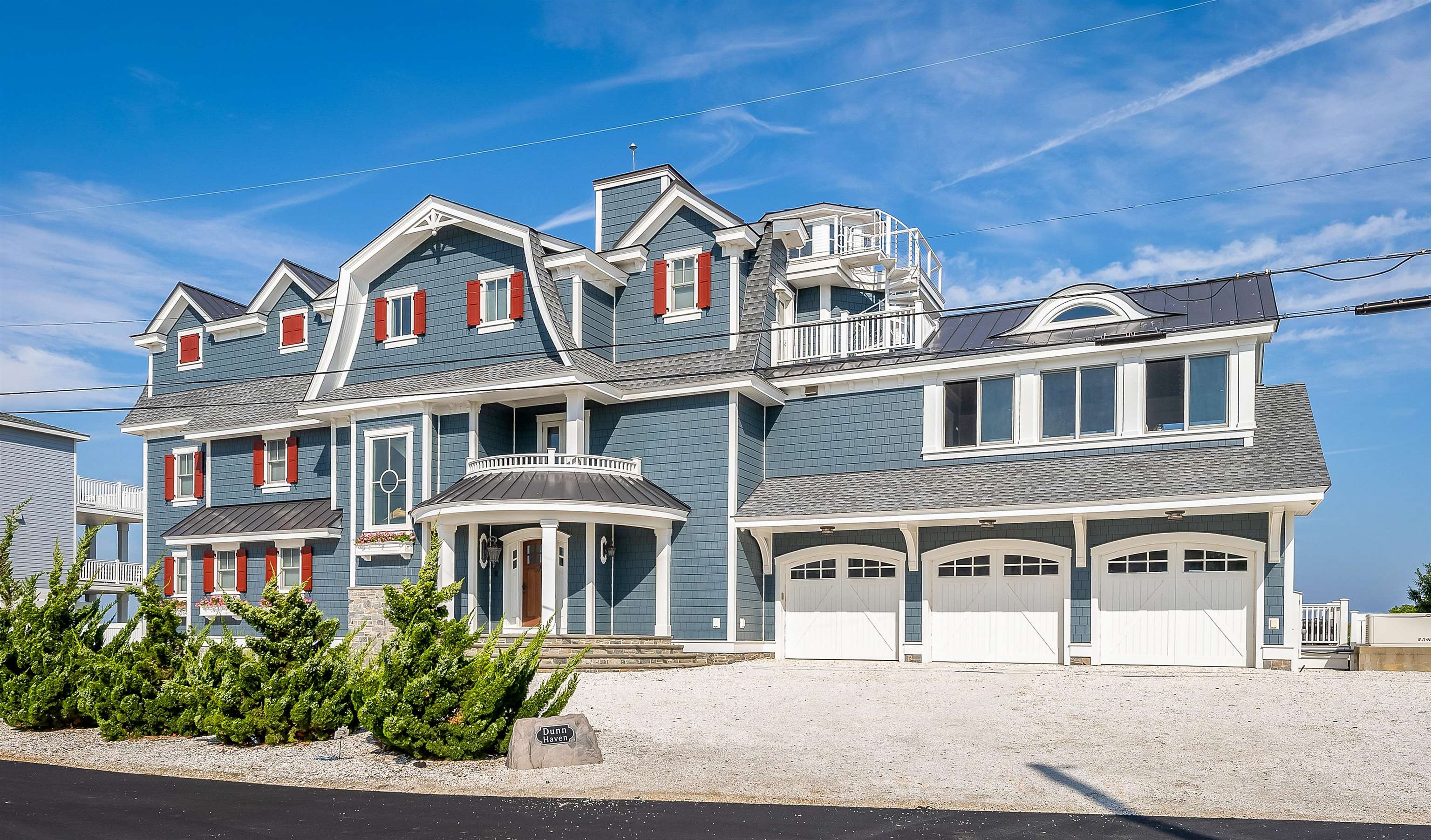 a front view of a residential apartment building with a yard