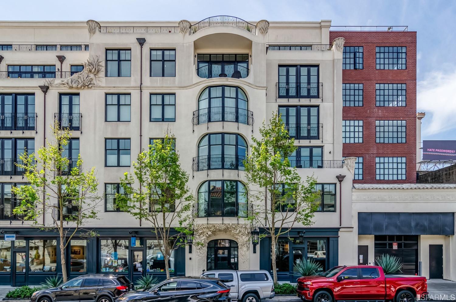 a front view of a building with parking space and windows