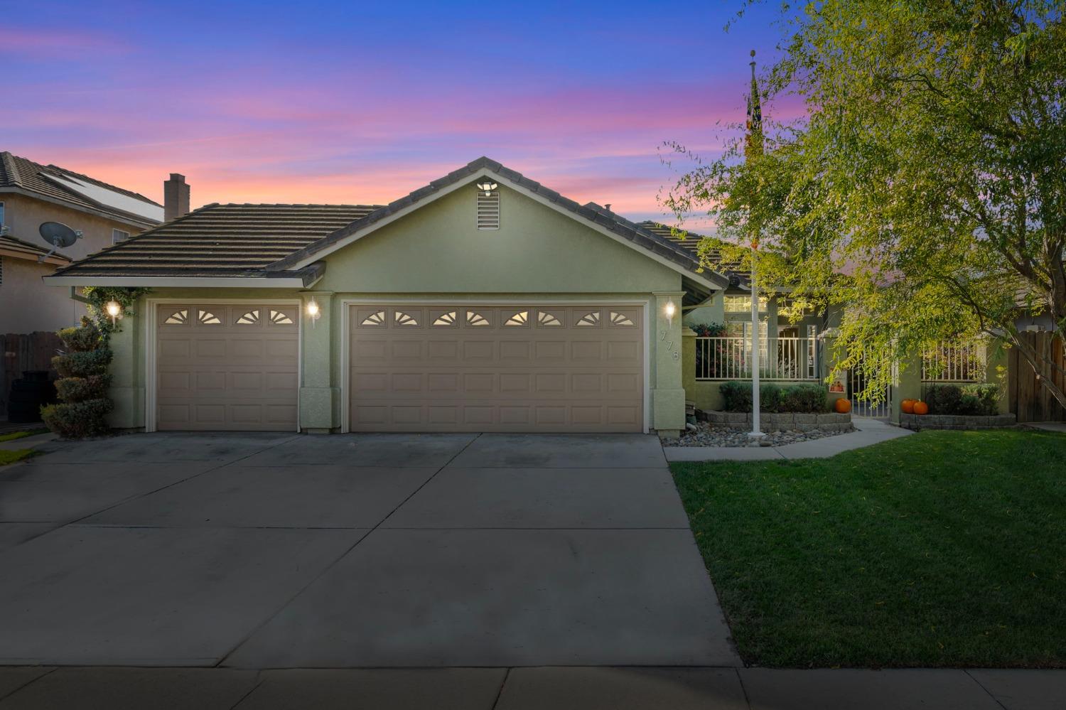 a front view of a house with yard