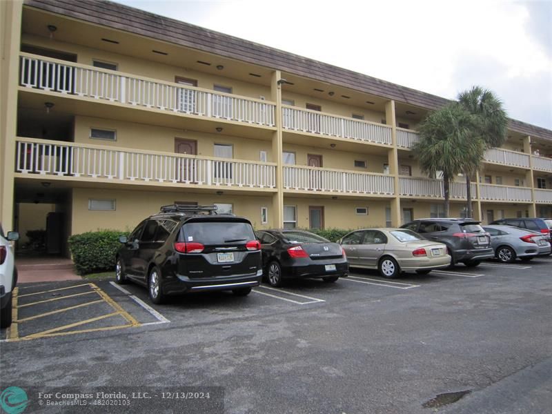 a view of a cars parked in front of a building