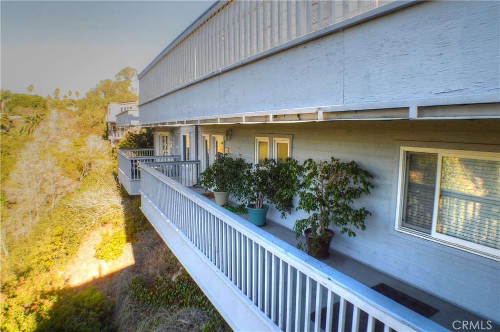 a view of balcony with wooden floor