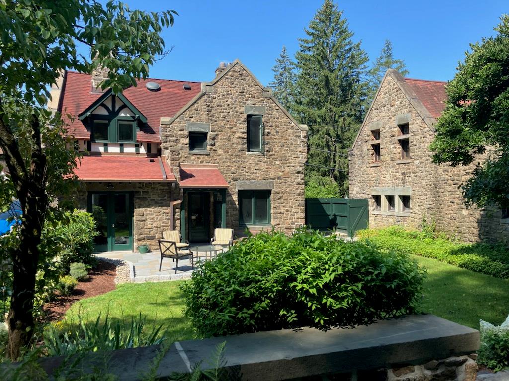 Terraced Courtyard view of house with Stone walls