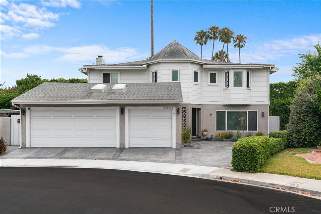 a front view of a house with a garage