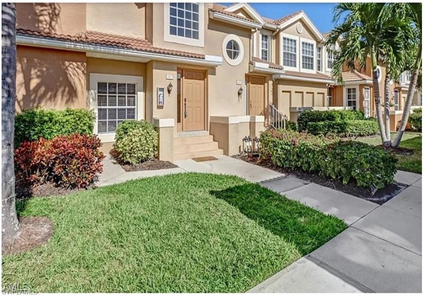 front view of a house with a yard