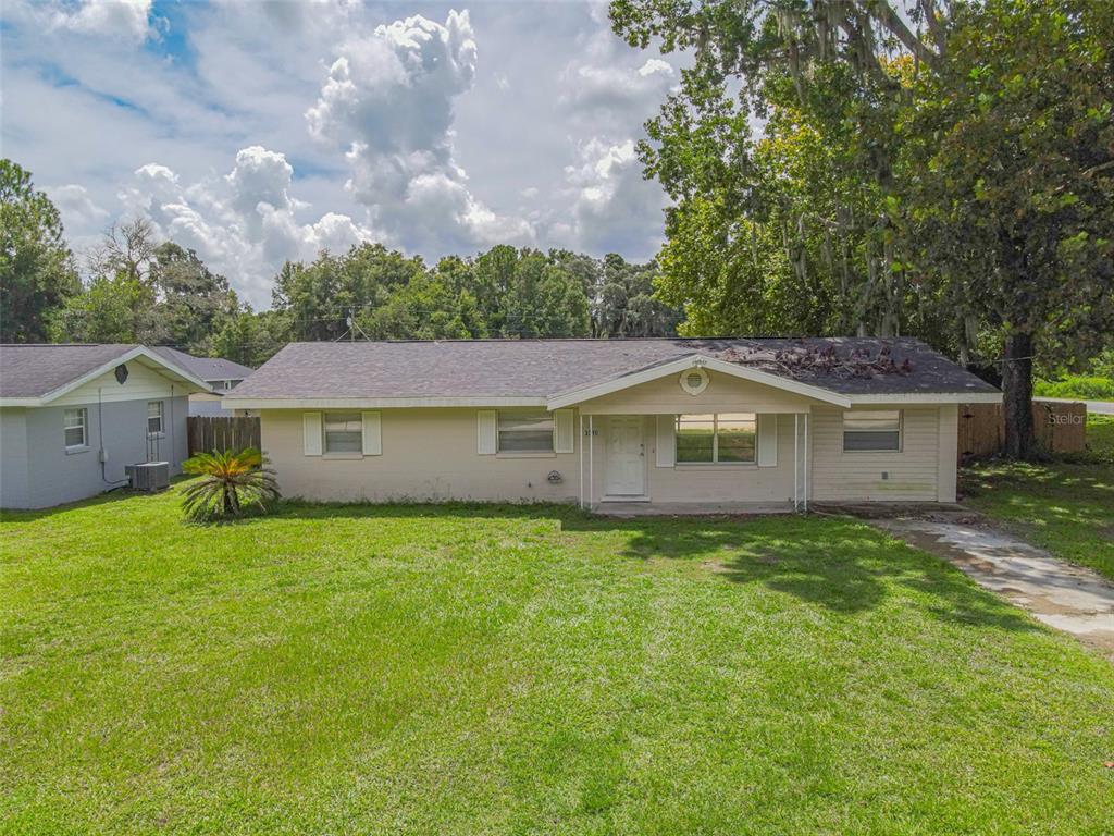 a front view of a house with yard