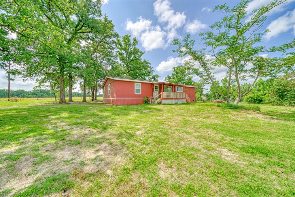 a view of a house with a big yard