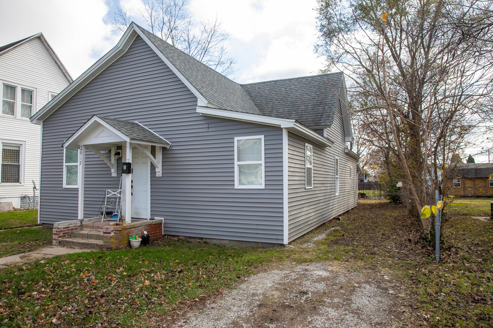 a view of a house with a yard