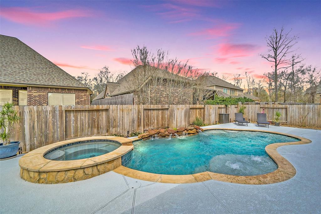 a view of a house with swimming pool and a yard