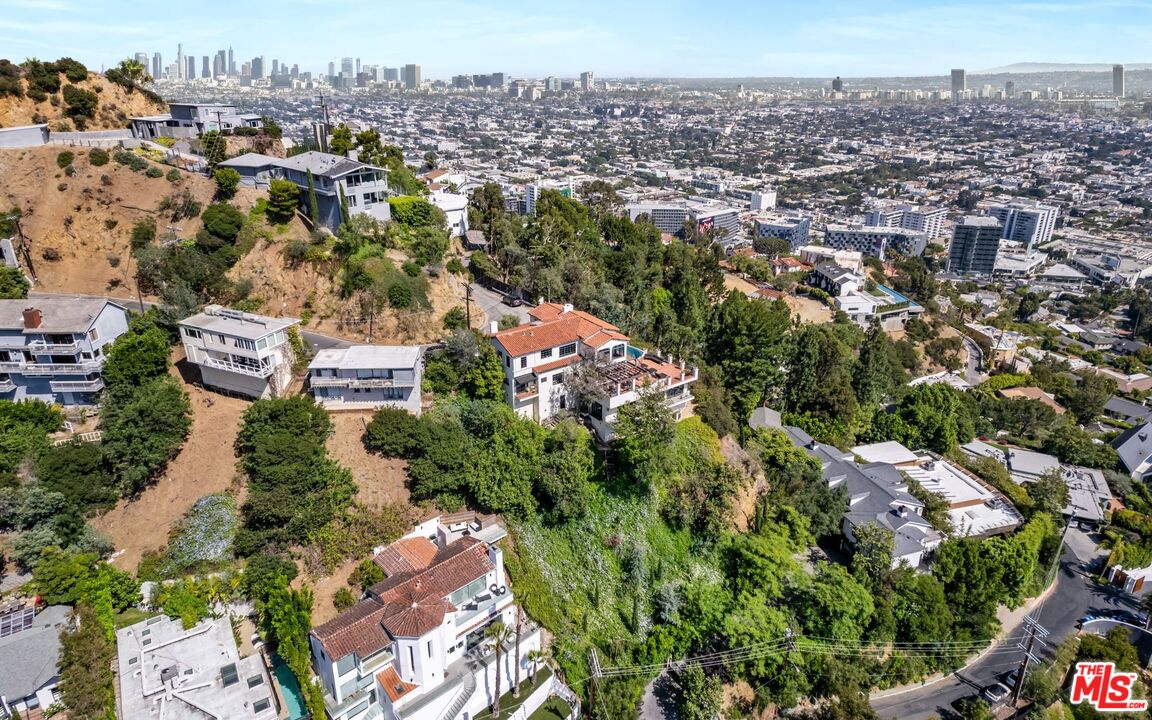 an aerial view of residential house and outdoor space