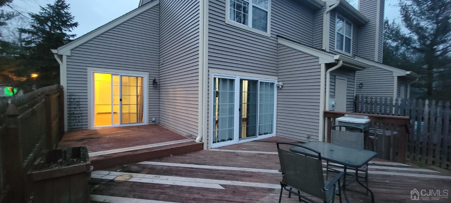 a front view of a house with sitting area